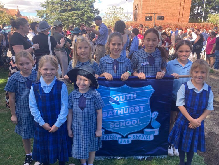 student group with school banner at ANZAC Day March