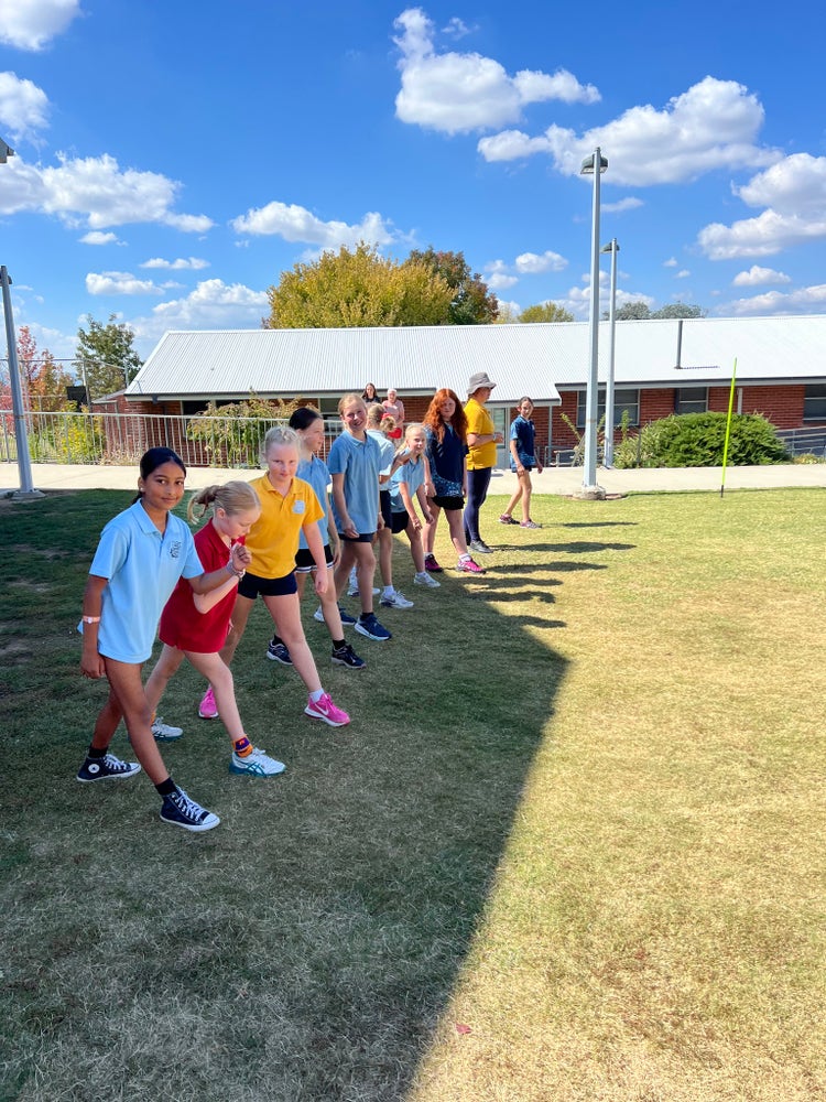 Group photo of girls at start line for Cross Country run